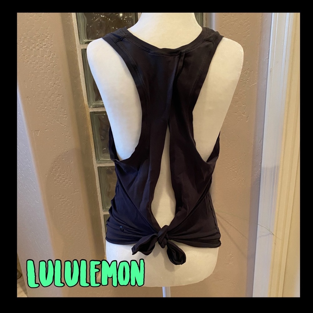 Gently loved Black Lululemon racerback top with slit up the back